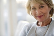 Attractive mature woman smiling — Stock Photo