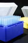 Laboratory storage boxes for pipette tips on table. — Stock Photo