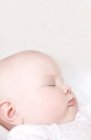 Infant baby sleeping in bed. — Stock Photo