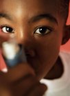Asthmatic boy using inhaler, close-up. — Stock Photo