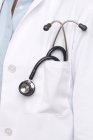 Close-up of doctor stethoscope in uniform pocket. — Stock Photo