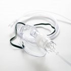 Nebulizer with tube against white background. — Stock Photo
