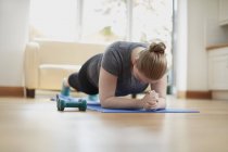 Woman in plank position — Stock Photo