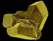Micrografía electrónica de barrido coloreado (SEM) de cristales de azúcar de mesa (sacarosa) . - foto de stock