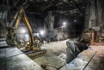 Heavy machinery inside marble quarry of Carrara, Italy. — Stock Photo