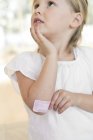 Elementary age girl with plaster on elbow. — Stock Photo