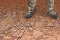 Digital artwork of pair of legs on surface of red planet Mars. — Stock Photo