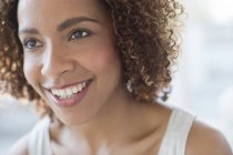Happy woman smiling and looking away — Stock Photo