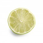 Metade de limão sobre fundo branco . — Fotografia de Stock