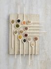 Legumes in wooden spoons, overhead view. — Stock Photo