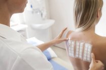 Female patient undergoing patch test in allergy clinic. — Stock Photo