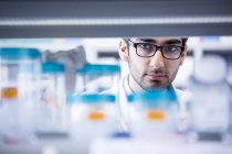 Male laboratory assistant wearing glasses. — Stock Photo