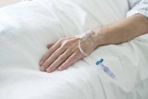 Close-up view of patient hand with cannula. — Stock Photo