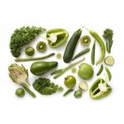 Fresh green produce on white background. — Stock Photo