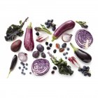 Fresh purple produce on white background. — Stock Photo