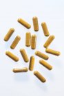 Turmeric supplement capsules, studio shot. — Stock Photo