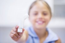 Close-up of inhaler in elementary age kid. — Stock Photo