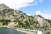 Dam at Mountain lake in Colomers, Catalan Pyrenees, Spain. — Stock Photo