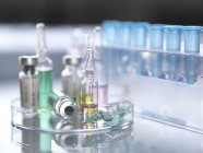 Variety of potential drugs in pharmaceutical vials and test tubes. — Stock Photo