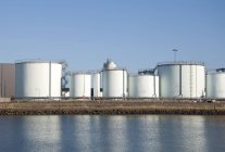 Storage tanks at oil refinery at shore in Danmark. — Stock Photo