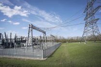 Electricity generating substation and connection to high voltage power lines. — Stock Photo