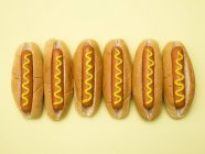 Hot dogs against plain background. — Stock Photo