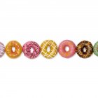Colorful doughnuts in a row, studio shot. — Stock Photo