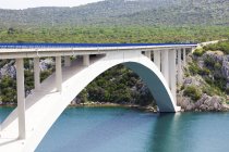 Paski most bridge over sea strait in Croatia hills. — Stock Photo
