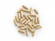 Supplementi di perdita di peso in capsule su sfondo bianco . — Foto stock