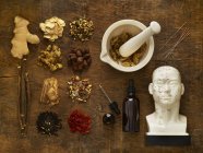Herbs and equipment for alternative medicine on wooden background. — Stock Photo