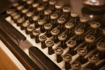 Close-up of round keys on antique keyboard of vintage type machine. — Stock Photo