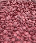 Illustration of pile of red coated medical tablets, full frame. — Stock Photo