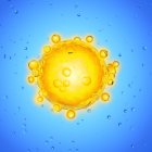 Illustration of yellow human egg cell on blue background. — Stock Photo