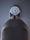 Illustration of low section of obese man on weight scale. — Stock Photo