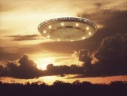 UFO flying in sky at sunset, illustration. — Stock Photo