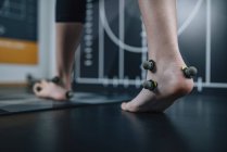 Feet of teenager with reflective marking balls for gait analysis. — Stock Photo