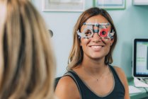 Female patient at eye examination in ophthalmology clinic. — Stock Photo
