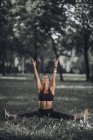 Athletic woman stretching after exercise in park. — Stock Photo