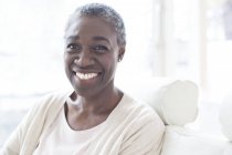 Portrait of mature woman smiling and looking in camera. — Stock Photo