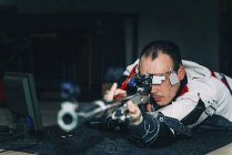 Mid adult man practicing sports rifle shooting. — Stock Photo