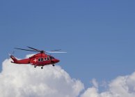 Medical helicopter in blue sky with cloud. — Stock Photo