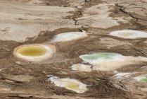 Sinkholes caused by receding water level of Dead Sea, Israel. — Stock Photo