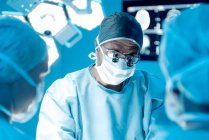 Surgical team performing brain surgery. — Stock Photo