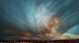 Dramatic sky during thunderstorm over urban cityscape. — Stock Photo
