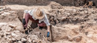 Archaeological excavations. Human skeleton remains found in an ancient tomb. — Stock Photo