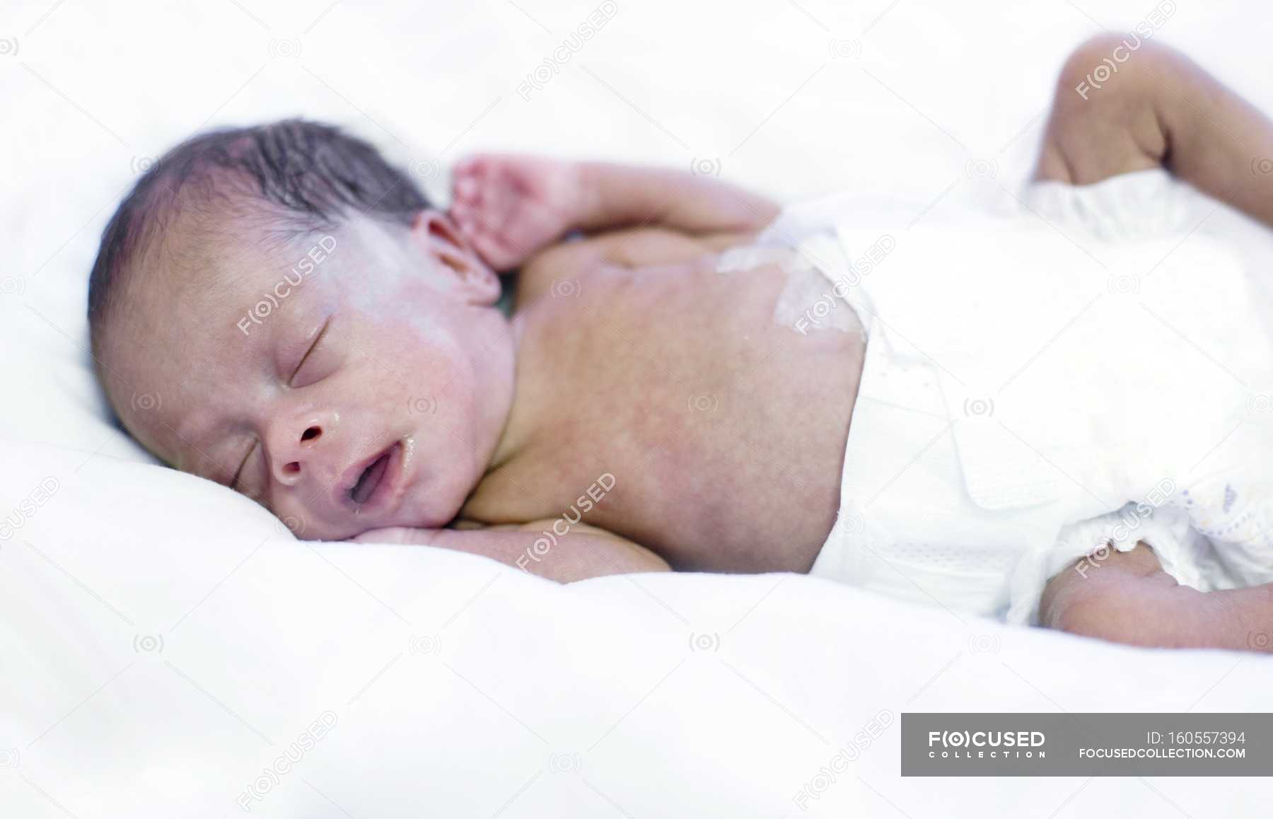 Premature Baby Sleeping In Ward Pediatrics Diaper Stock Photo