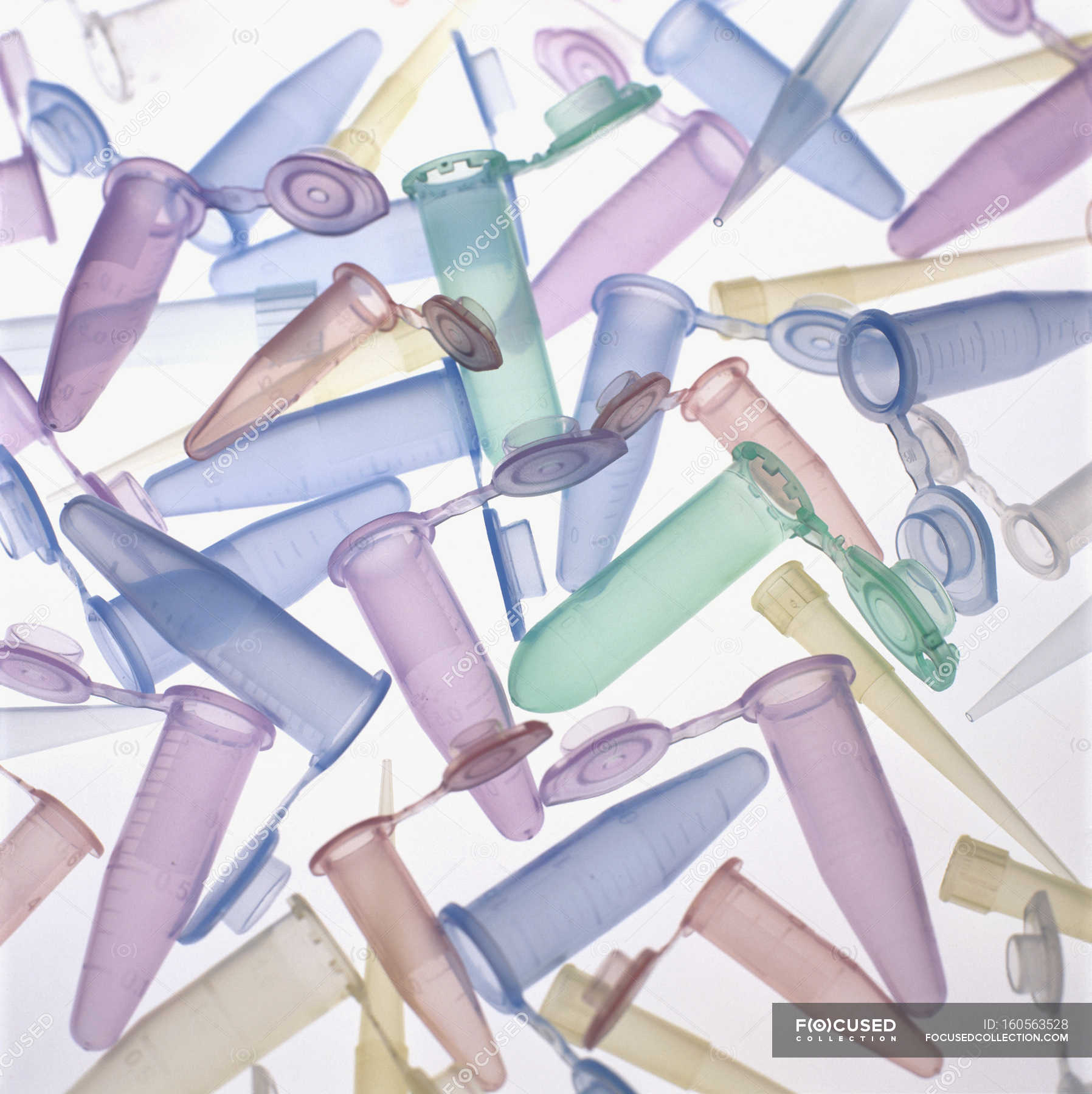Assorted disposable plastic pipette tips and sample tubes. — containers