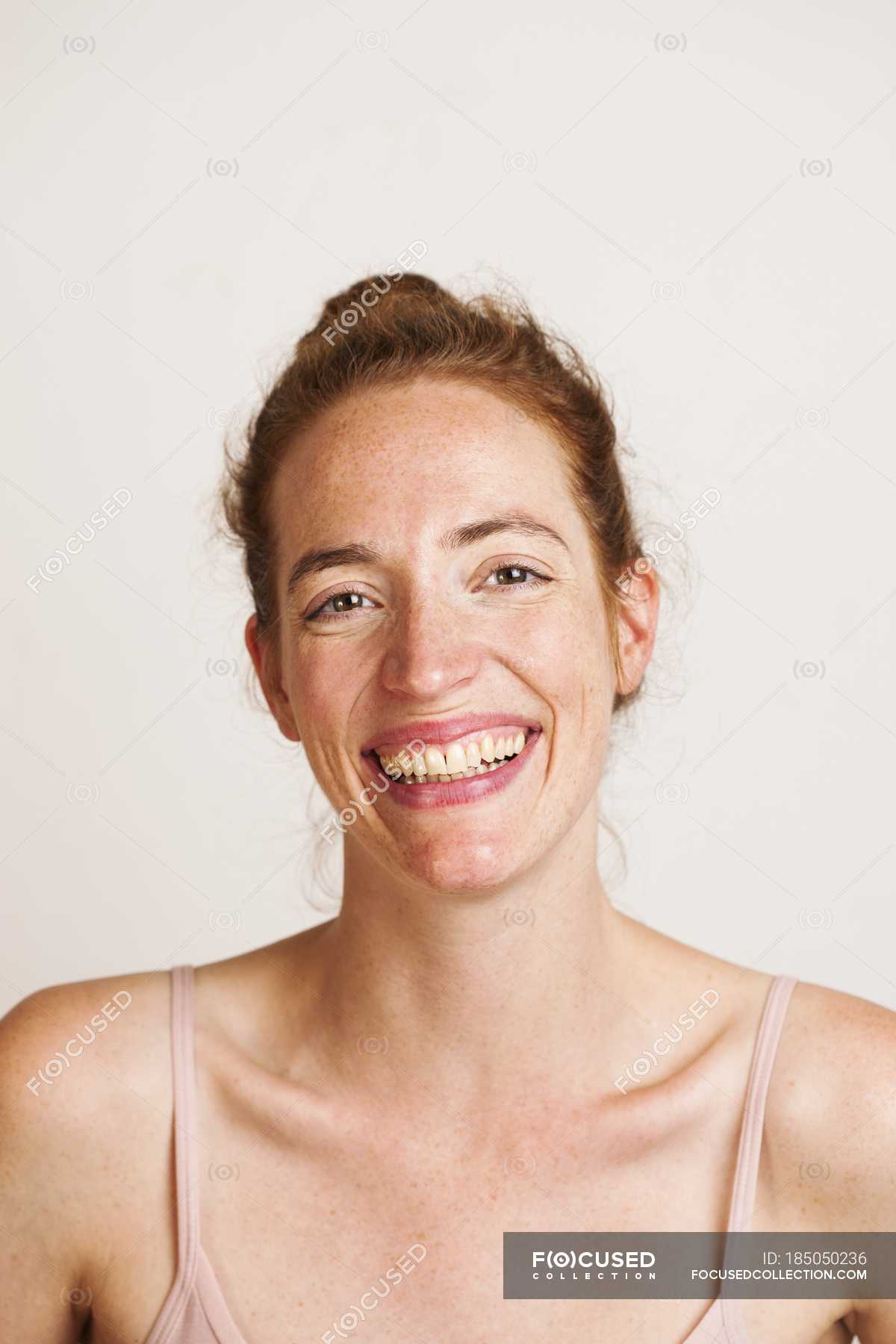 Redhead Woman Smiling And Looking In Camera Studio Shot Head And Shoulders Gaze Stock Redhead Woman Smiling And Looking In Camera Studio Shot Head And Shoulders Gaze Stock