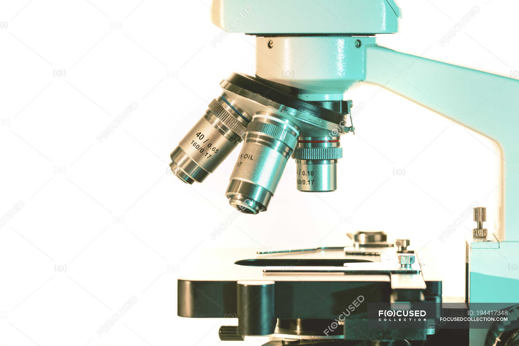Closeup of light microscope stage and lenses. — selective focus, optics Stock Photo 194417348