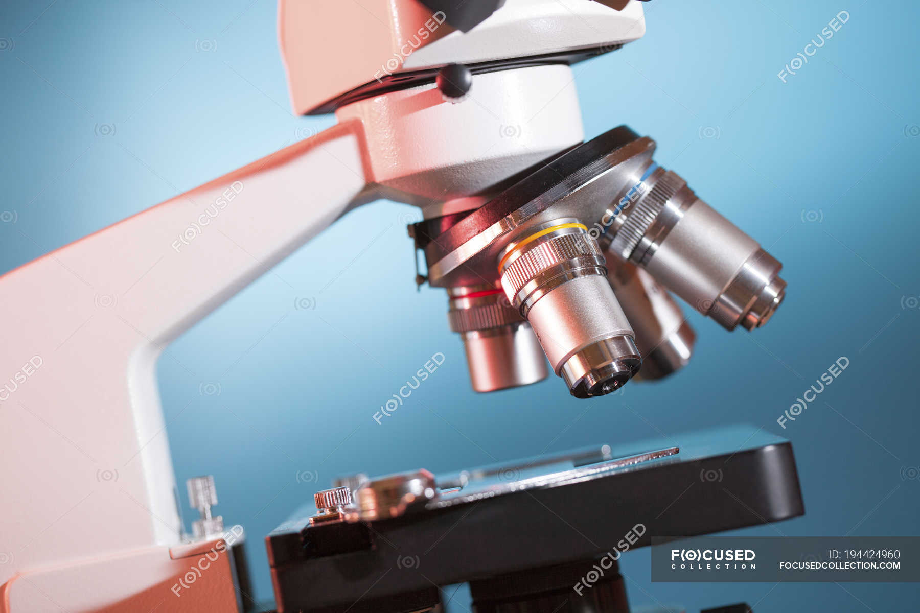 Closeup of light microscope stage and lenses. — microscopy, instrument